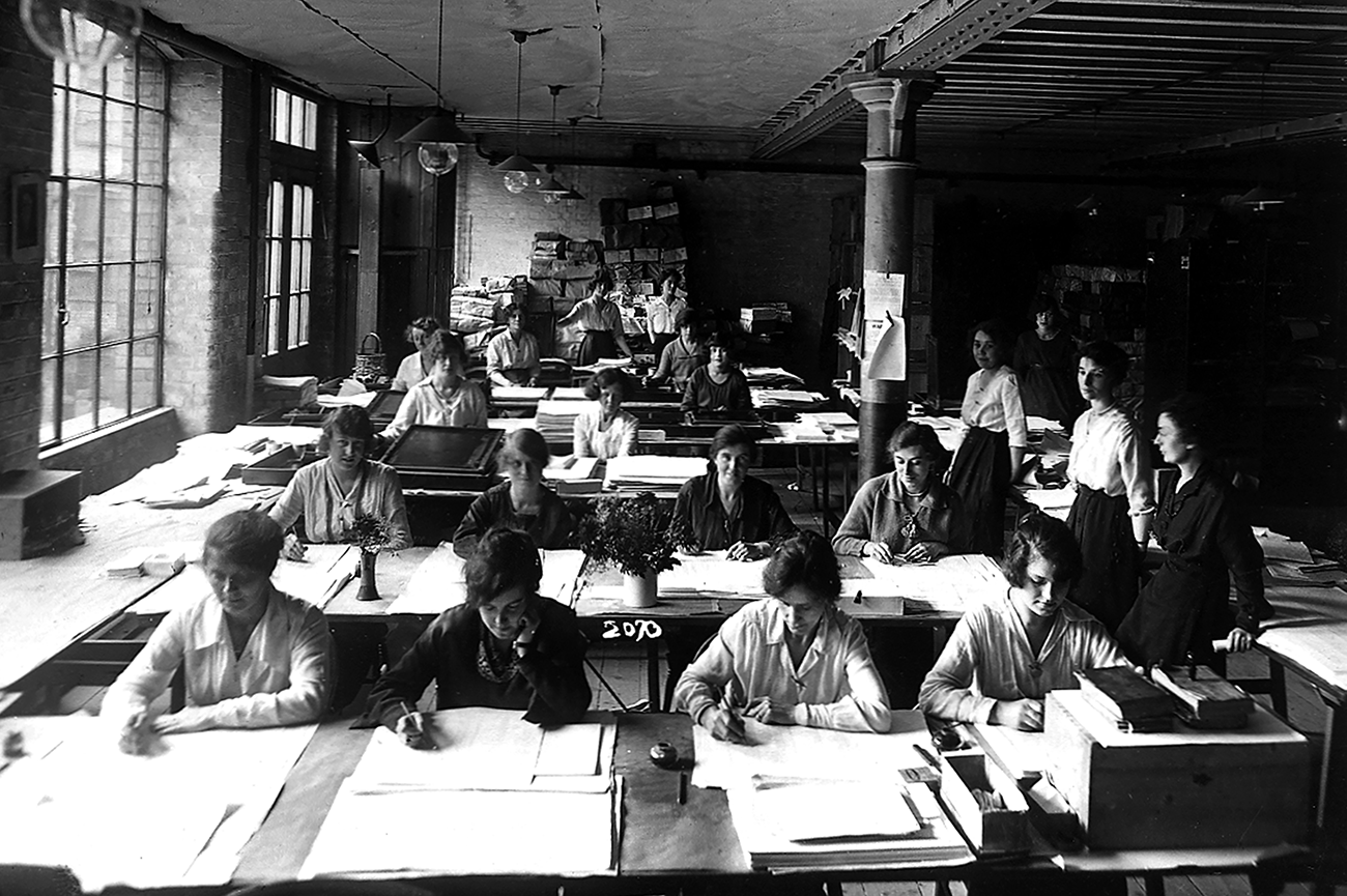 Black and white photo showing women working on the reprographic process, 1920